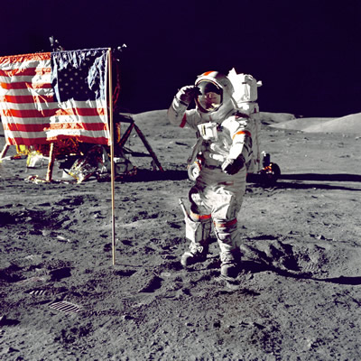 Neil Armstrong saluting the flag on the moon.